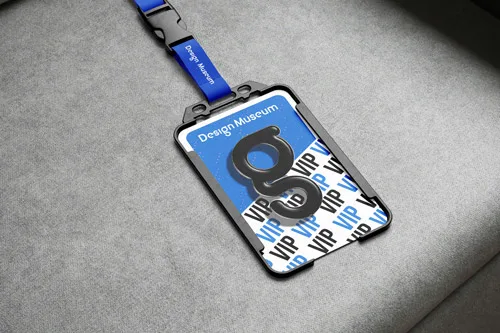 This image consists of a lanyard holding a VIP pass for the design museum. the design consists of a light blue top half cut through diagnlooly with the bottom displaing the words 